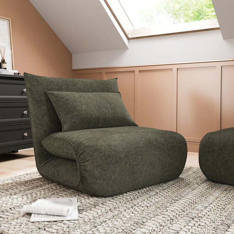 dark green folded sofa bed in small room