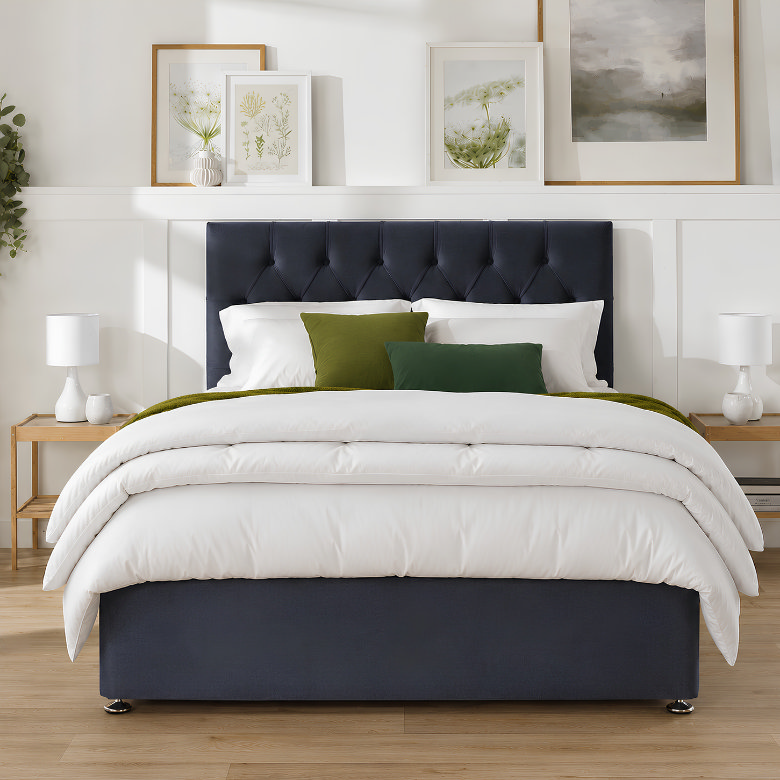 Layered white duvets folded across a bed to create extra loft and cloud-like comfort for a five-star hotel style bed.