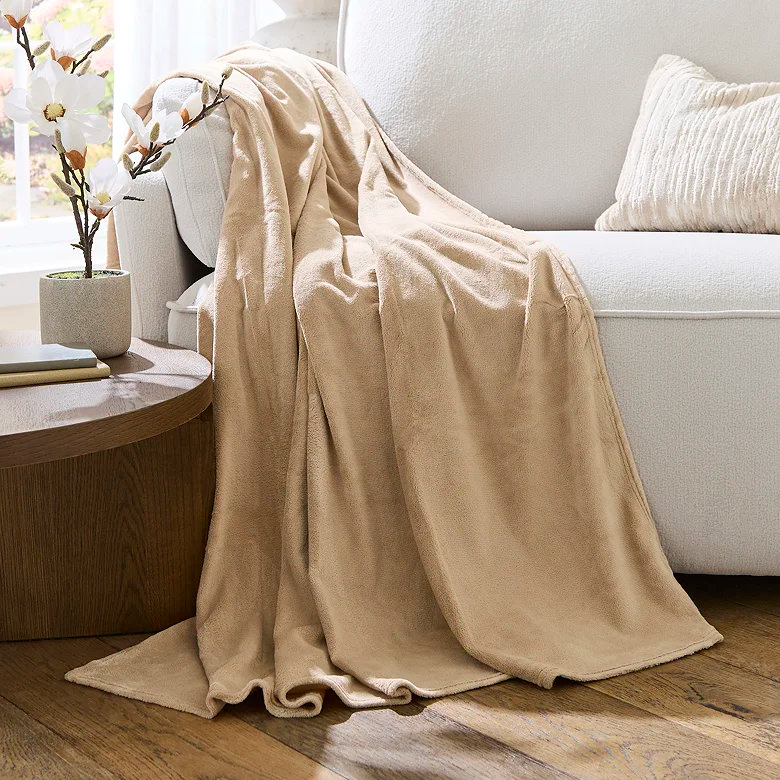 cream super soft fleece winter throw across sofa