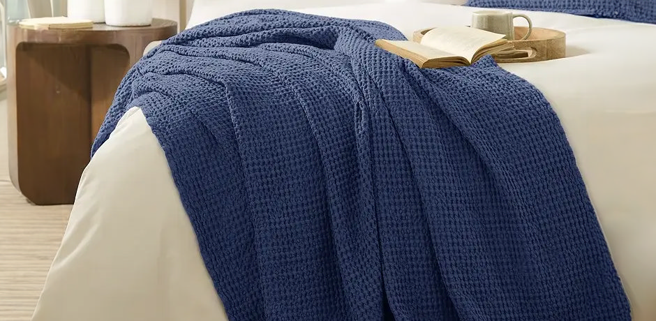 blue warm winter throw over bed