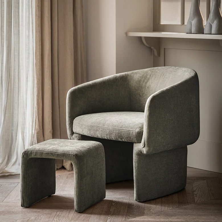 grey curved accent chair and footstool for office