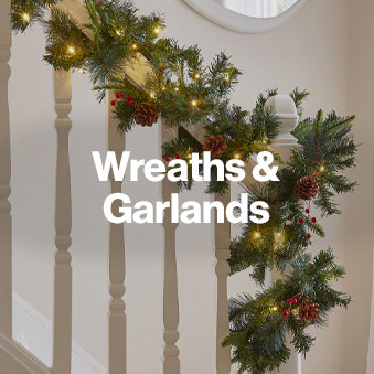 Lit Up Wreath On Stairs