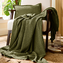 Trending Category - Throws - Green throw on chair