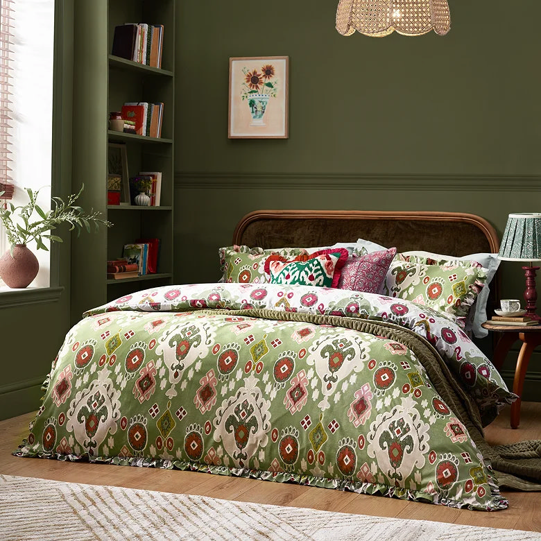 green patterned duvet cover set with floral boho print in dark green bedroom