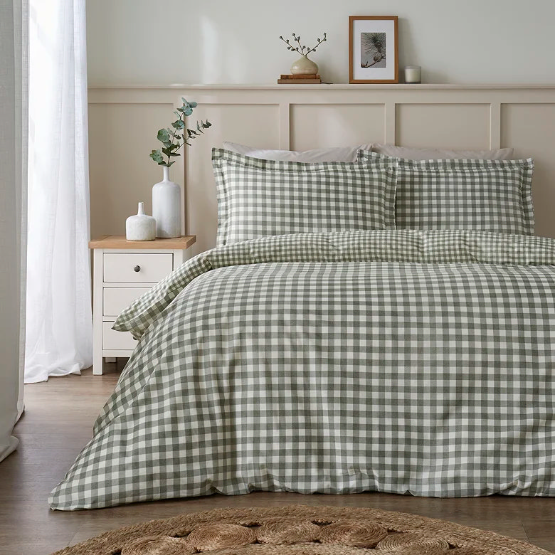 green gingham duvet cover set with matching pillowcases in a cosy neutral bedroom