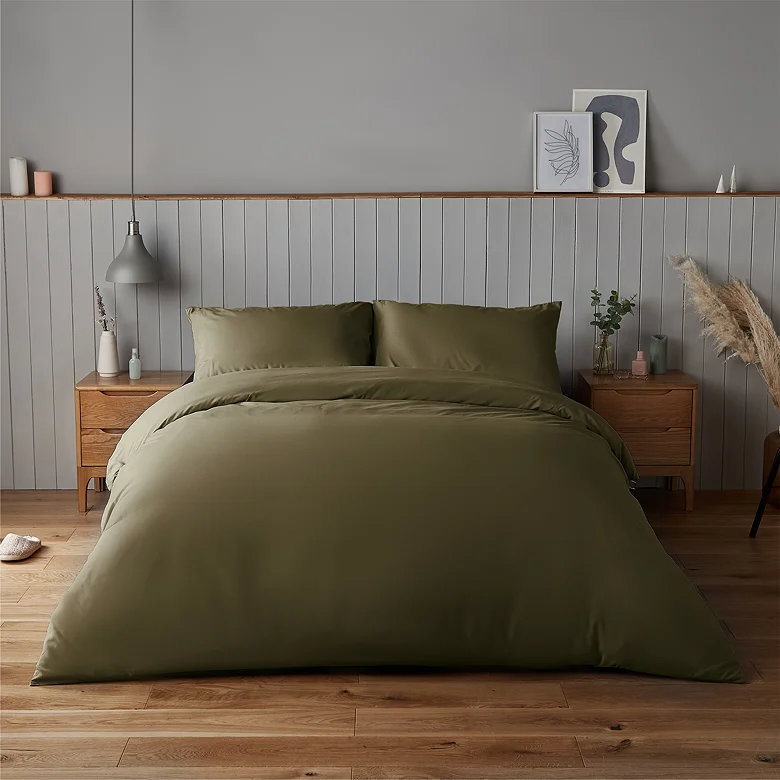 olive green bedding set with plain duvet cover in a warm, earthy bedroom