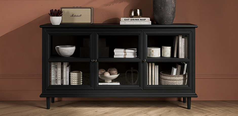 black glassfronted display cabinet with decor