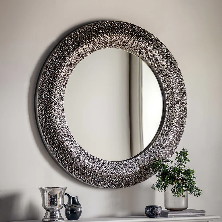 large dark metallic hallway mirror with filigree detailing
