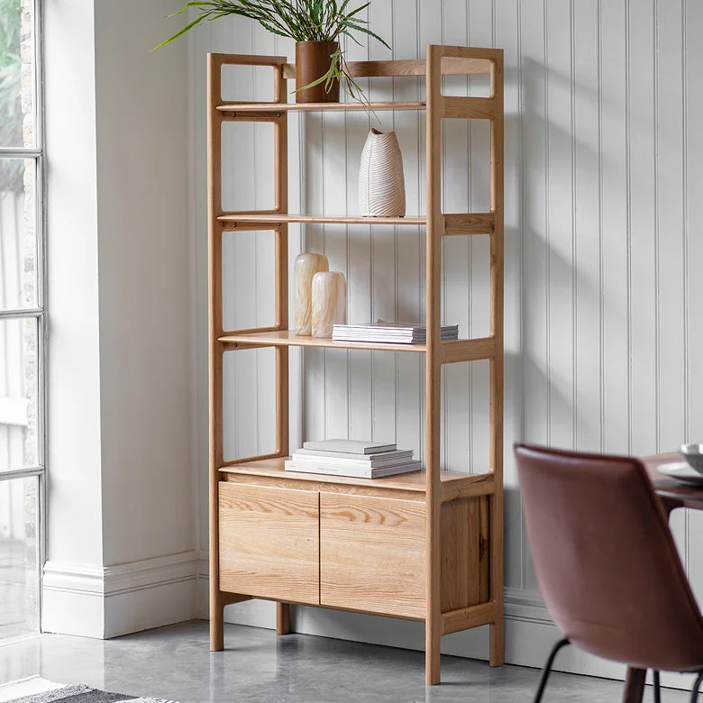 tall open shelving unit with cupboards in hallway