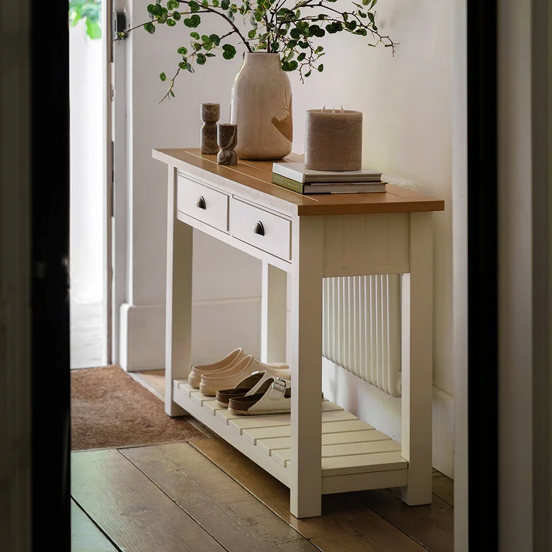 traditional white wooden console table in hallway