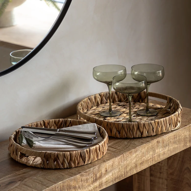 woven round storage trays on hallway table