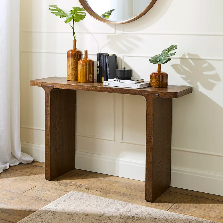 dark wood minimalist console table in hallway