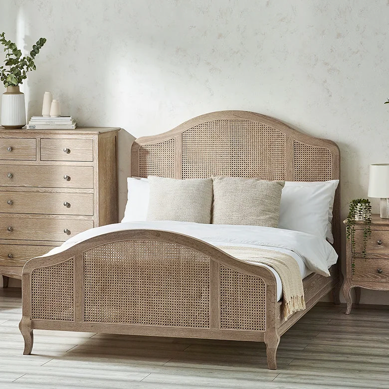 rattan bed in rustic farmhouse style bedroom