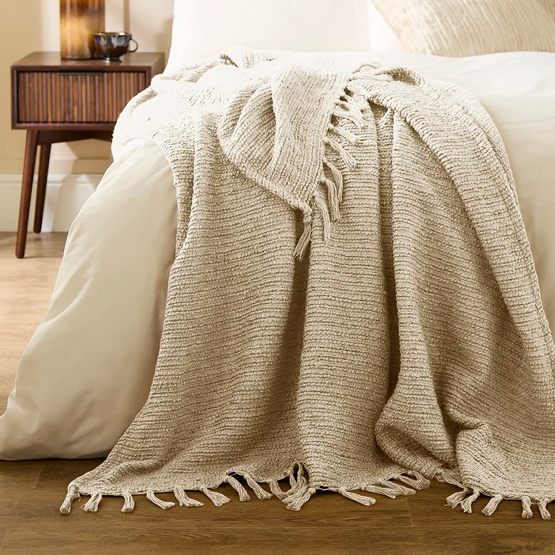 cream coloured rustic woven throw with tassels