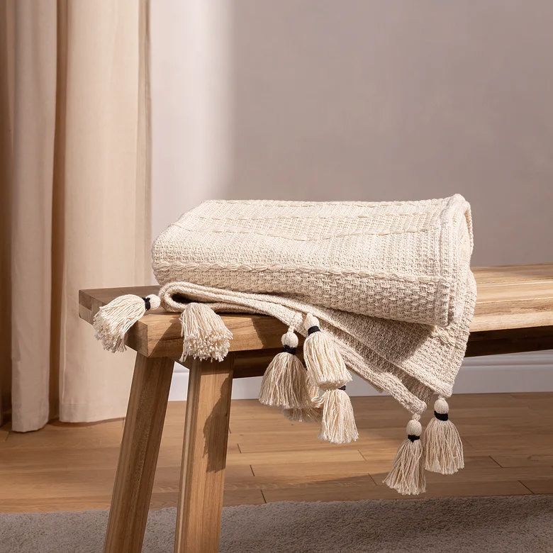 rustic natural colour throw on wooden bench