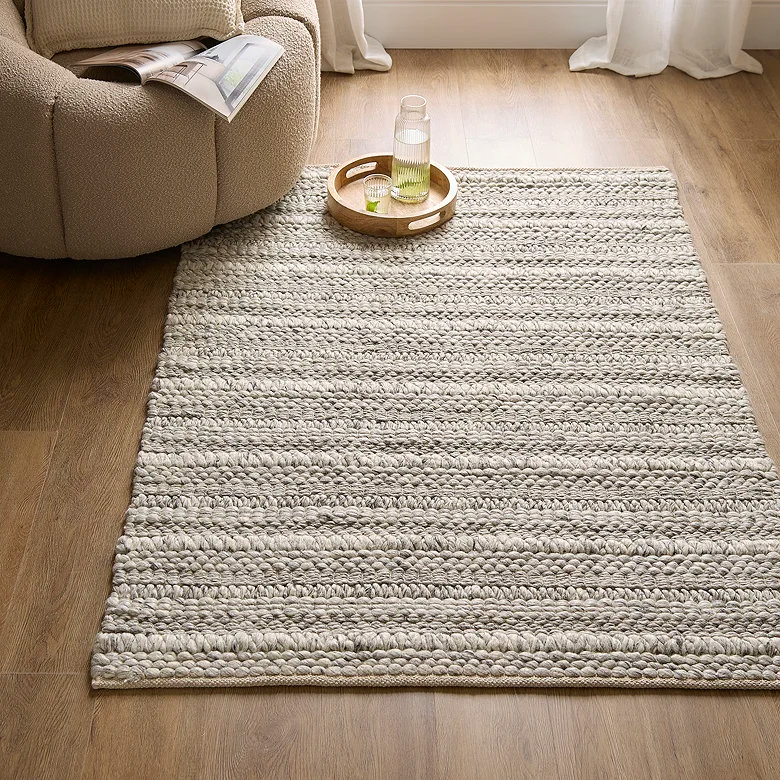 rustic style woven rug in farmhouse bedroom
