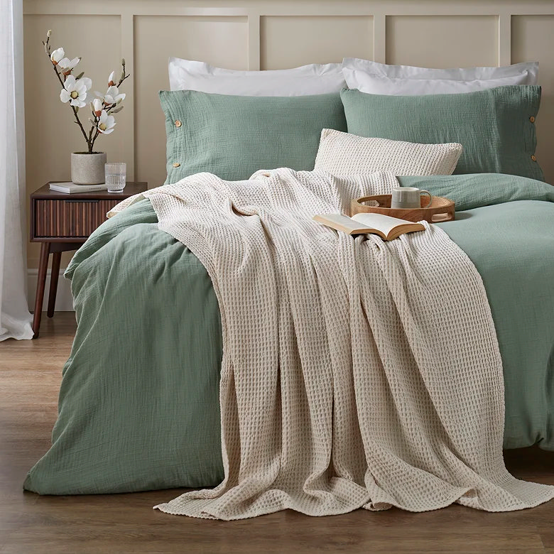 cream waffle weave cotton throw in farmhouse bedroom