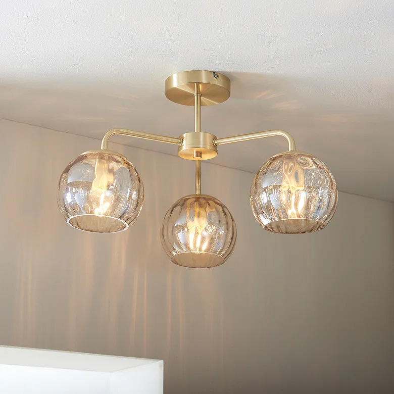 glass three lamp ceiling light in home office