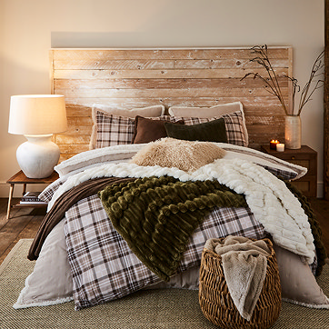 Bed with throws and cushions
