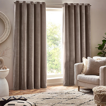 Curtains with armchair in front