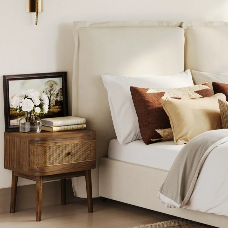 dark wood bedside table with picture frame decor