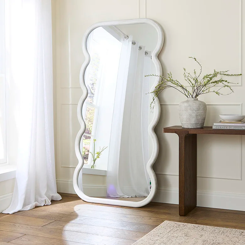 white curved frame bedroom floor mirror