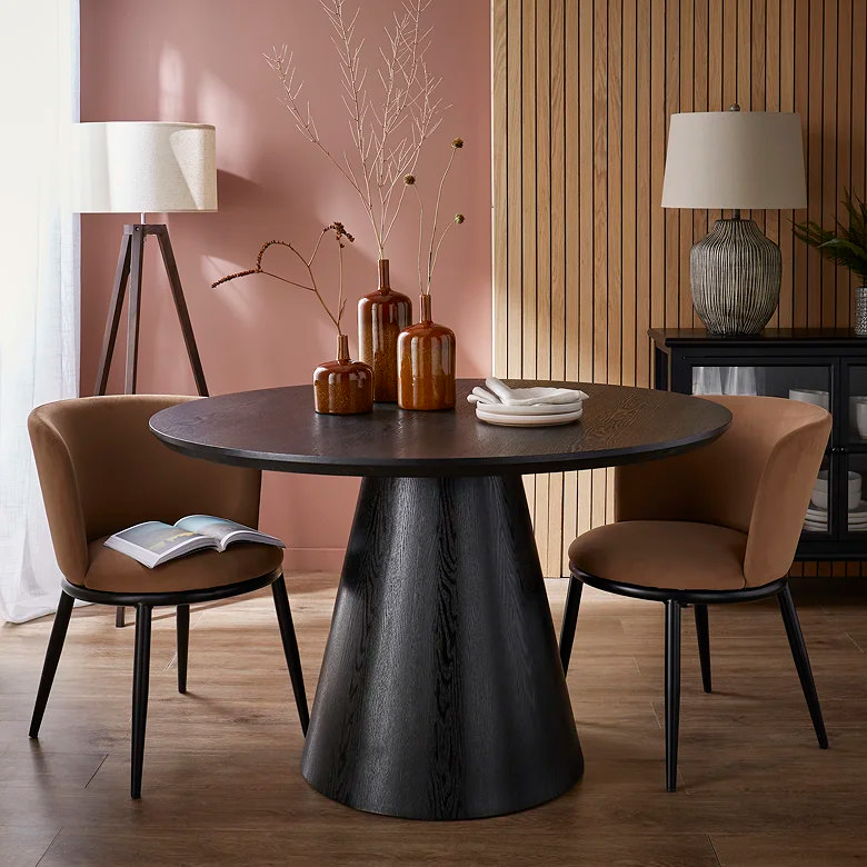 small round dark dining table with two chairs