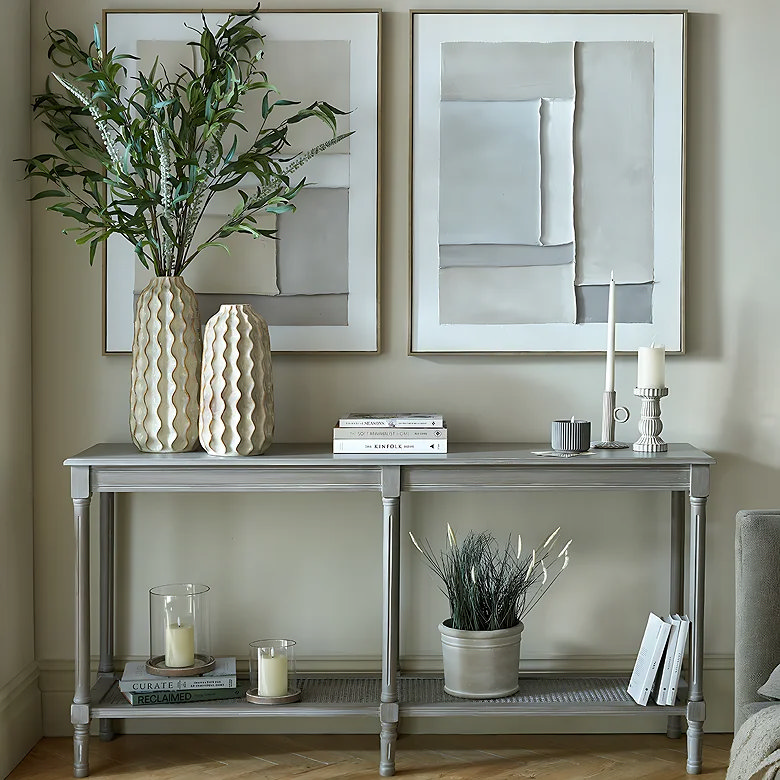 light wooden and rattan console table in office