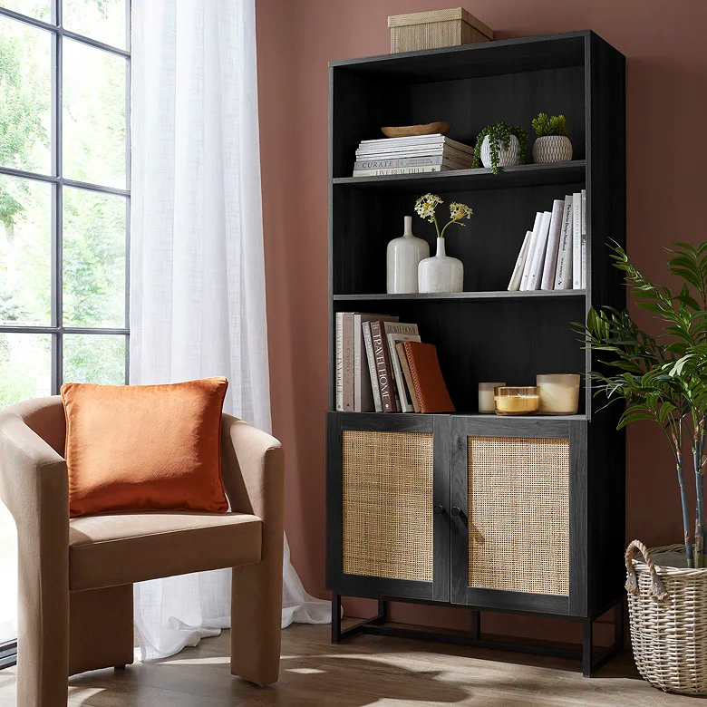 black and rattan bookcase with cupboards and shelves