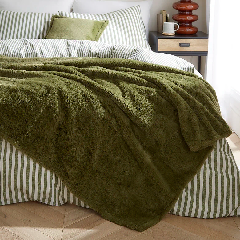 olive green Japandi faux fur throw in bedroom