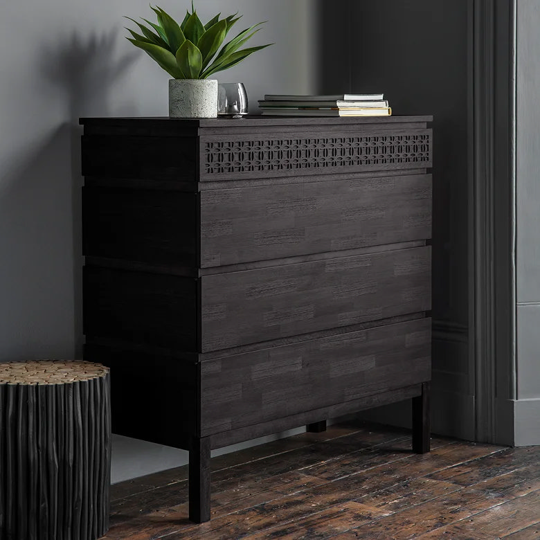 black wooden Japandi chest of drawers in bedroom