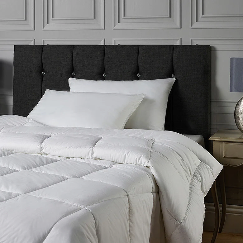 white duvet and pillows, black bed