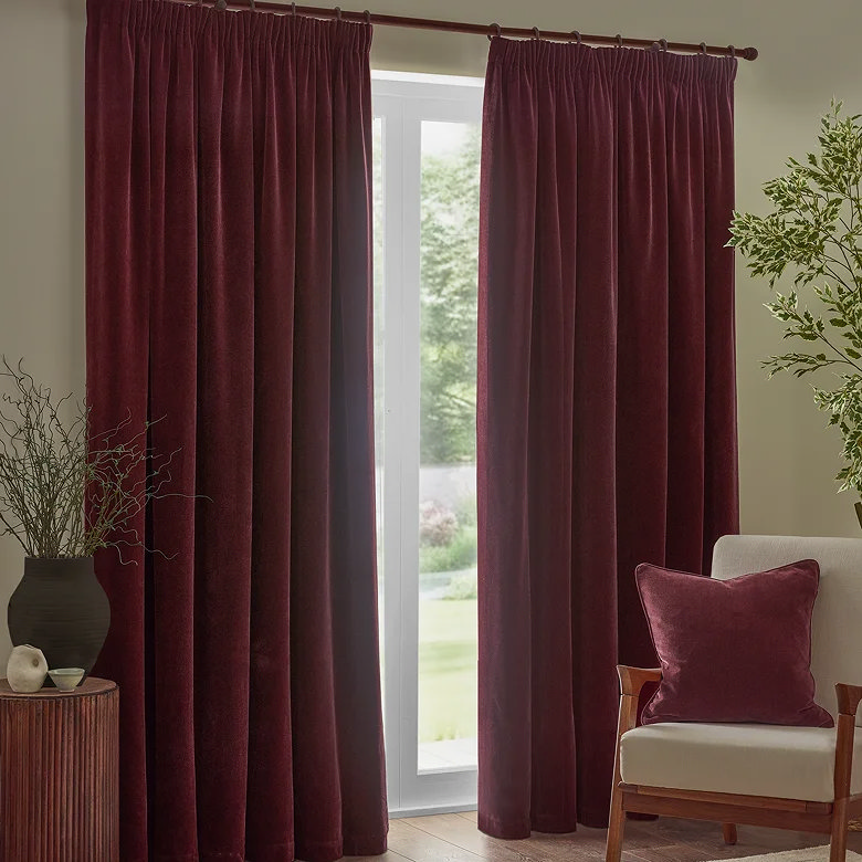 dark red pencil pleat curtains in home office