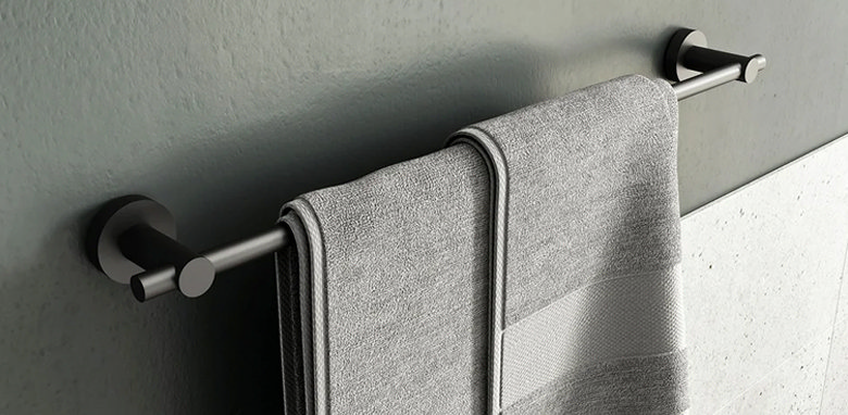 grey towel hung over a grey towel bar