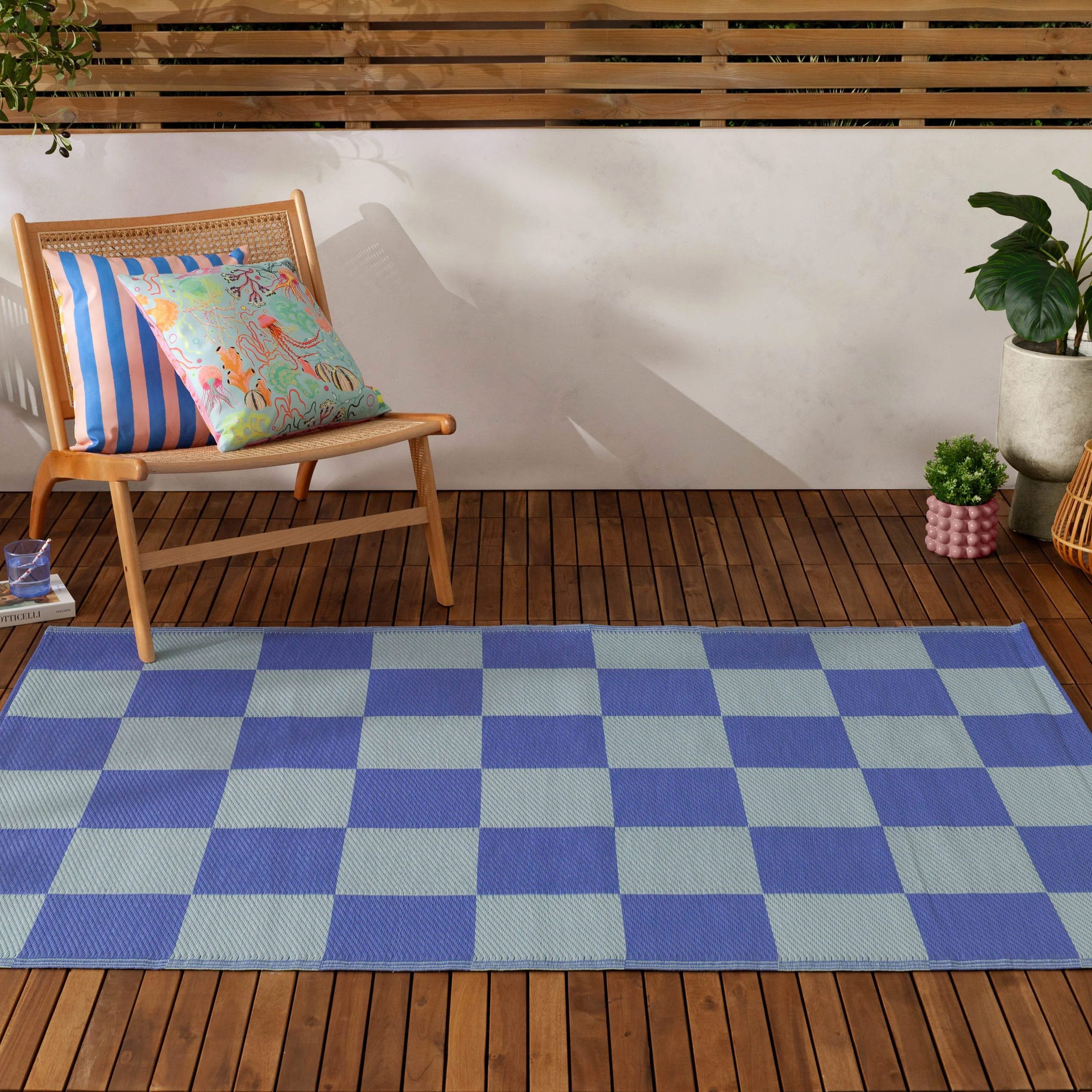 blue checkerboard outdoor rug for garden sanctuary