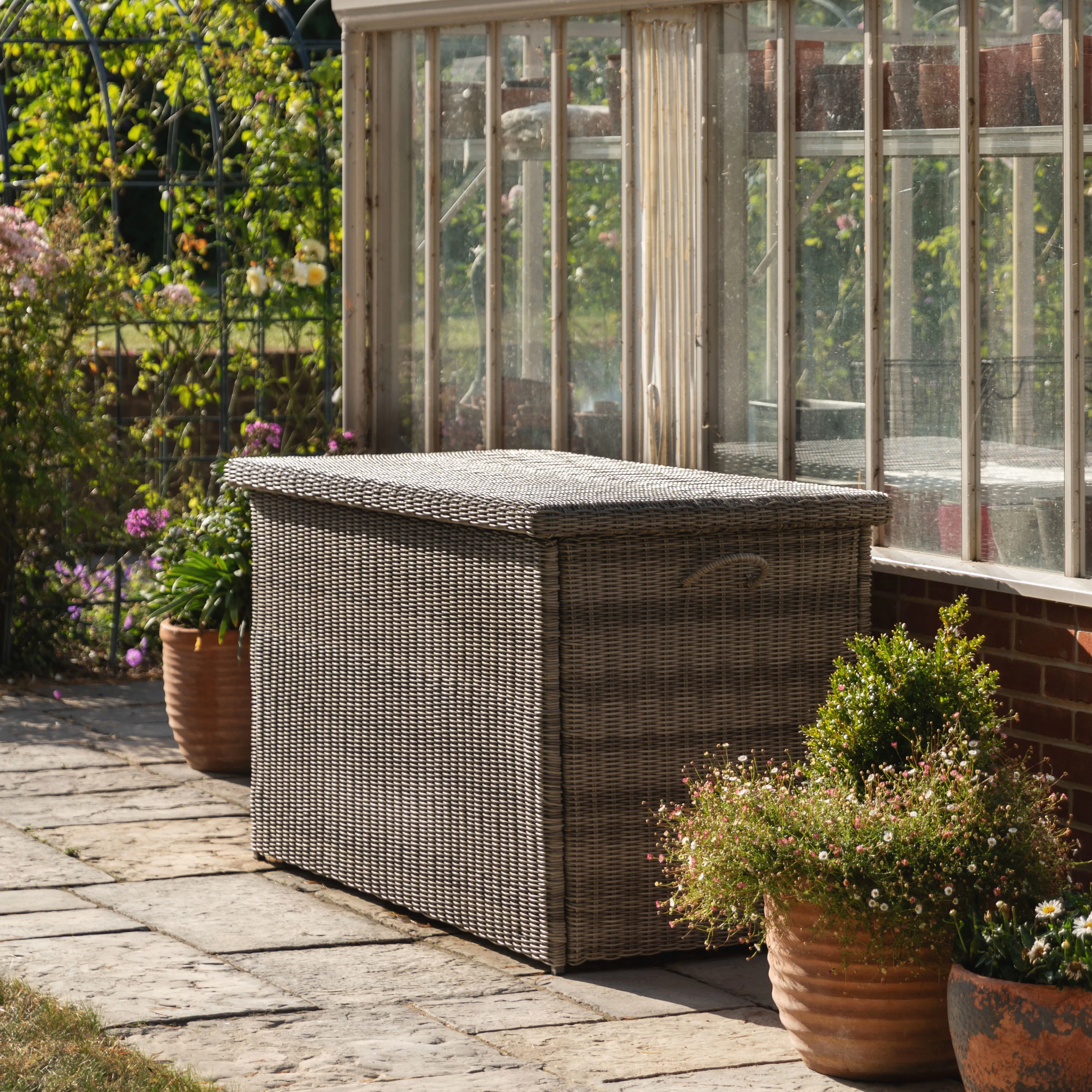 rattan storage box in garden sanctuary with plants