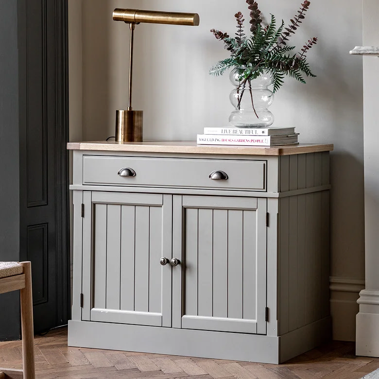grey painted wooden sideboard with table lamp
