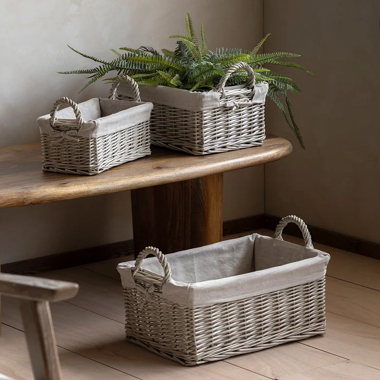 set of three rectangular linen lined storage baskets