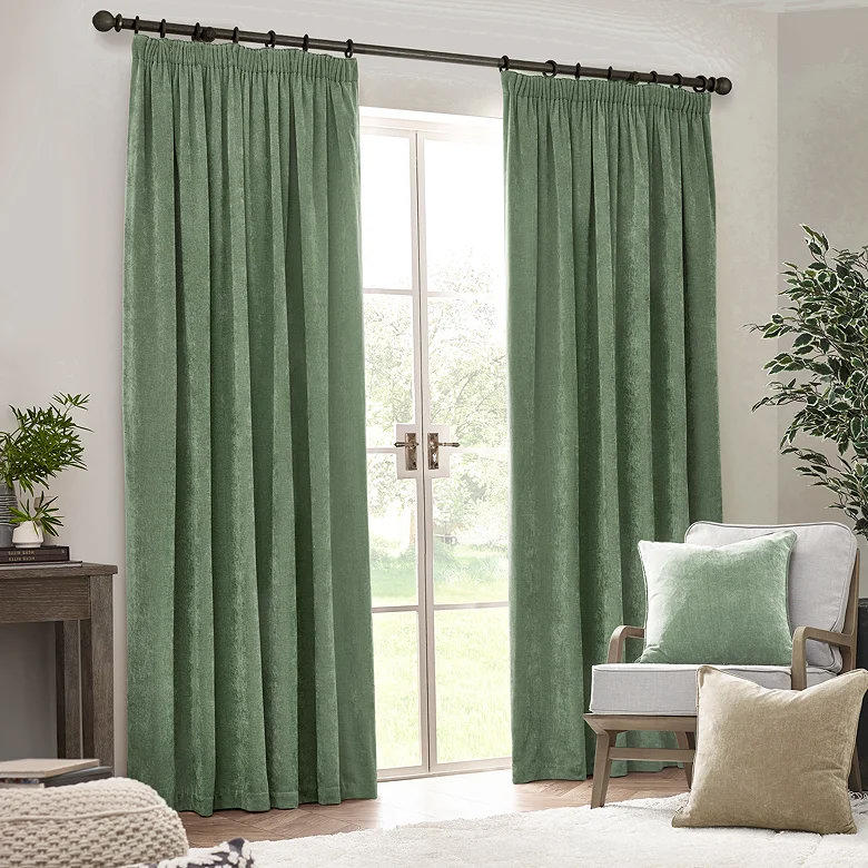eucalyptus green chenille curtains in cosy living room with earthy tones and soft natural textures