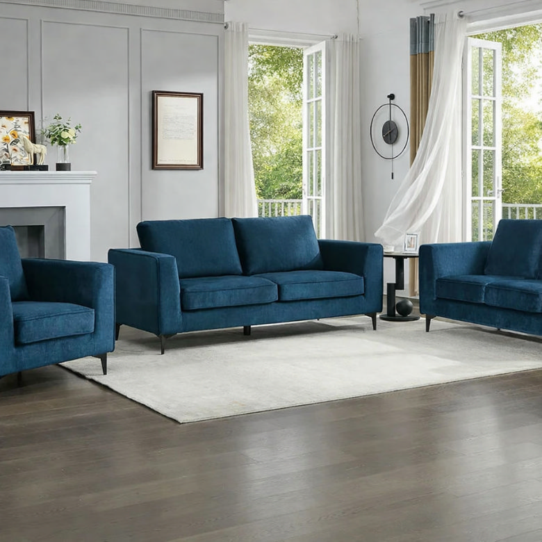 Bright and airy living room with blue sofas, open windows and natural light, ideal after a spring clean