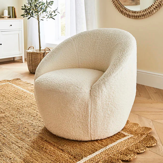 Curved bouclé tub chair for small bedroom reading nook