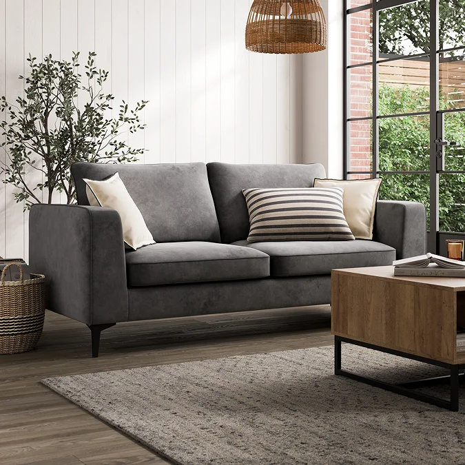 Charcoal two seater sofa with two ivory squares and a centred striped lumbar cushion, illustrating the three cushion rule for small sofas.