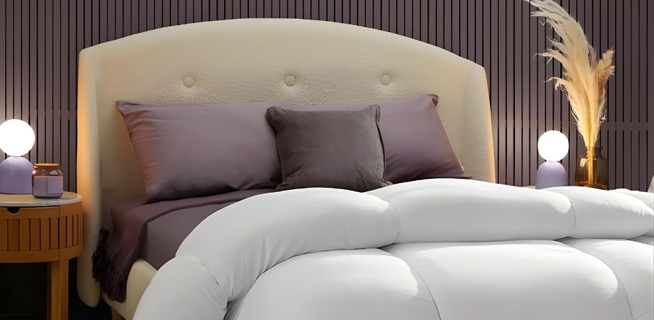 Arched cream headboard, plum bedding, white duvet