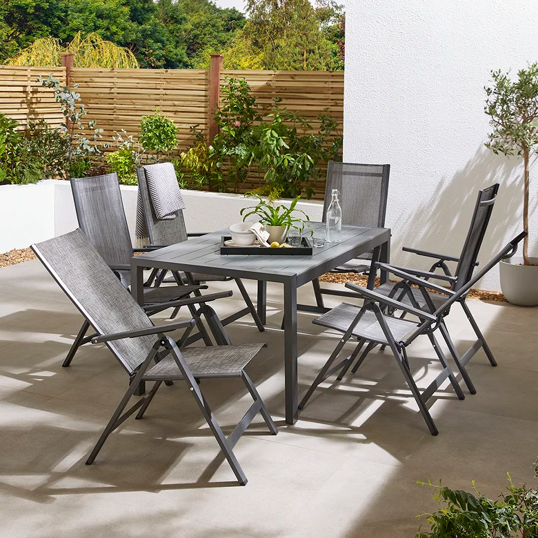 Luxury 6 seater recliner garden dining set with grey chairs and modern outdoor dining table on patio