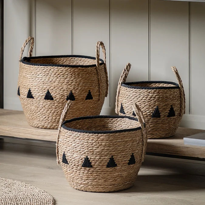 Decorative woven baskets with handles, styled in neutral interior — ideal toy storage solution.