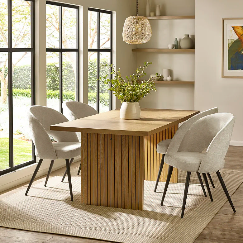 woven pendant light over dining table with natural wood dining set