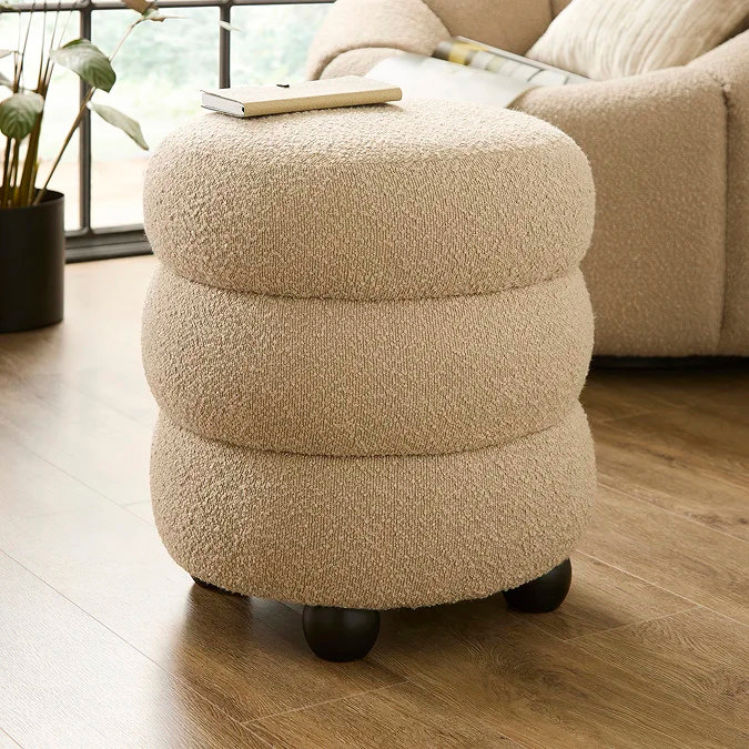 Beige bouclé pouffe for small bedrooms; feet-up comfort, extra seating or mini side table; soft, space-saving lounge seat