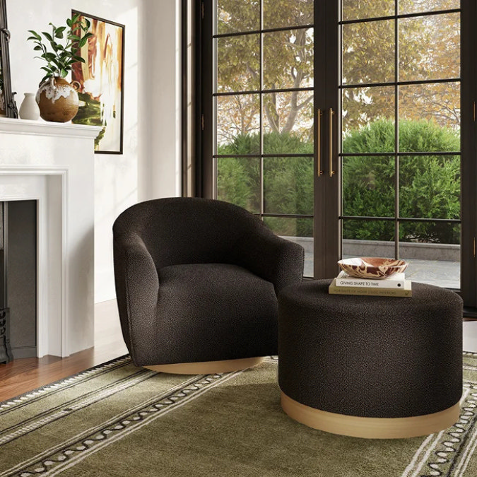 compact black boucle chair with matching footstool for small bedrooms