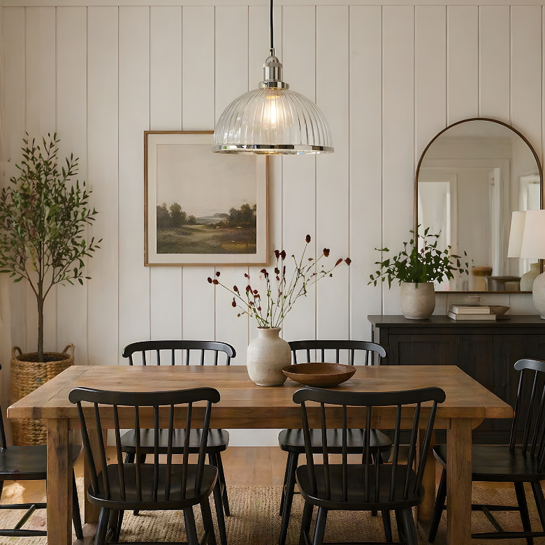 ribbed glass pendant light over dining table with soft warm glow