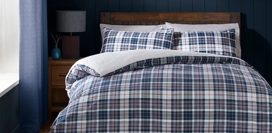 Cosy bedroom with brushed cotton check duvet cover and matching pillowcases in navy and white